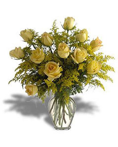 Dozen yellow roses in a glass vase
