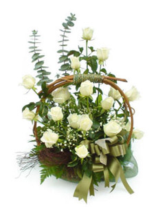 White roses arranged in a basket