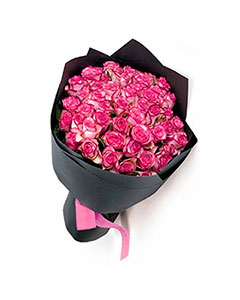 Bouquet of pink roses in kraft paper