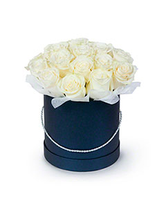 White Roses in a Round Black Box